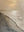 A vertical hand-painted minimalist oil painting of a beach seascape with heavy 3D plaster textures representing ocean waves in a neutral beige and sand color palette.