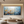Large-scale hand-painted 3D textured tree with yellow and white blossoms on a blue abstract background, displayed in a modern minimalist zen-style room.