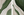 Close-up of a 2-piece hand-painted abstract oil painting set with thick forest green and beige 3D textured waves, evoking a natural landscape.