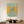 Handmade minimalist abstract oil painting featuring a woman in a white top and orange skirt standing atop a curved green staircase flanked by warm yellow walls.