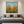 Premium handmade abstract oil painting depicting vibrant orange California poppies in a meadow under a sky blue cloud-dappled sky, created with heavy palette knife impasto texture