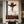 Handcrafted abstract cowboy oil painting with rich brown and white textures hanging in a modern living room