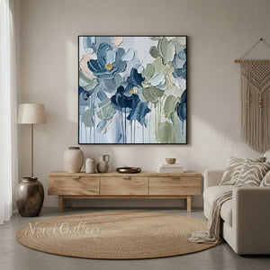 Hand-painted heavy texture abstract oil painting showing clustered blooming flowers in shades of muted blue and sage green with gold accents on a light grey background with paint drips.
