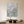 Handmade modern romantic abstract oil painting showcasing seven pink roses with vertical white and silver glitter paint drips cascading down against a misty sage green and grey gradient background.