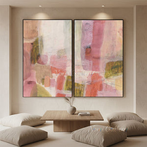 100% handmade modern abstract pastel oil painting featuring a diptych design in soft pink, beige, and earthy tones, displayed on a stylish staircase gallery wall above a white interior setting.