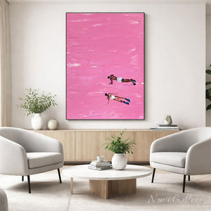 A 100% handmade abstract modern oil painting featuring a solid, textured barbie pink background representing water, with two detailed figures in swimsuits and diving fins swimming downwards.