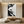 Close-up of a handmade 3D textured abstract face oil painting in black and white, featuring heavy impasto brushstrokes and minimalist artistic style.