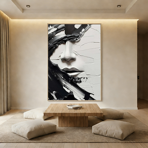 Close-up of a handmade 3D textured abstract face oil painting in black and white, featuring heavy impasto brushstrokes and minimalist artistic style.
