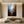 Hand-painted abstract oil painting of a solitary golden boat floating above a dark, reflective sea under a misty, glowing sky, styled for a modern Wabi-Sabi living room.