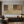 100% handmade abstract Wabi-Sabi oil painting featuring minimalist geometric lines and neutral earth tones, displayed in a modern living room setting.