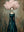 Handmade modern surreal abstract oil painting portraying a faceless female silhouette wearing a deep teal gown, crowned with a massive, voluminous 3D textured pink cloud-like floral hair against a distressed grey and brown background.