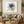 Premium handmade abstract oil painting featuring a vibrant purple anemone blossom surrounded by sage green botanical leaves on a soft cream background.