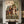 Handcrafted Americana folk art oil painting featuring striking cowboys and horses under a starry sky hanging in a modern living room