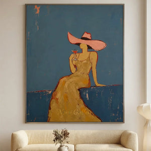 Handcrafted abstract cocktail lady oil painting with rich blue textures hanging in a modern living room or bar