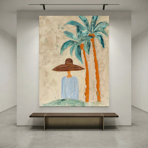 Handcrafted abstract coastal lady oil painting featuring palm trees with rich blue and orange textures hanging in a modern living room or bedroom