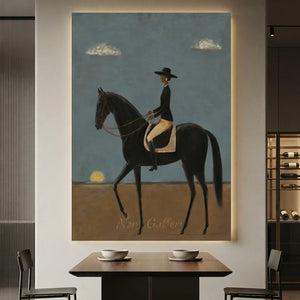 Handcrafted contemporary equestrian oil painting featuring a rider on a black horse against serene blue and brown tones hanging in a modern living room