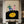 A hand-painted retro oil painting depicting a romantic couple dancing on a large black vinyl record with a yellow center, hung above a bed in a modern luxury bedroom.