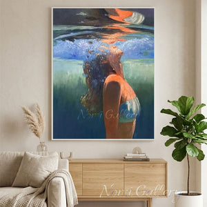 Handmade impressionist oil painting of a woman wearing a bikini diving underwater in a blue sea, with vibrant orange sunlight reflections and water ripples.