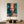 High-quality handmade impressionist oil painting showing a close-up underwater portrait of a woman's face covered in shimmering sunlight ripples, surrounded by a school of small silver fish in a deep teal sea.