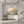 Hand-painted 3D textured golden tree with thick impasto blossoms on a grey and cream abstract background, styled in a minimalist modern living room.