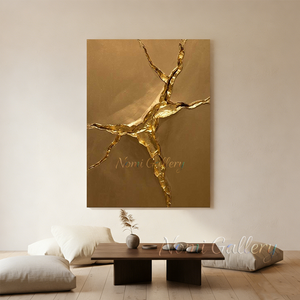 Large handmade 3D abstract canvas painting covered entirely in shiny metallic gold leaf, featuring dramatic flowing fluid plaster textures and deep ridges, displayed on a dark grey concrete minimalist living room wall above a modern grey sofa.