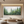 Hand-painted 3D textured abstract painting of a misty pine forest in shades of green and white, displayed in a modern minimalist zen-style living room.