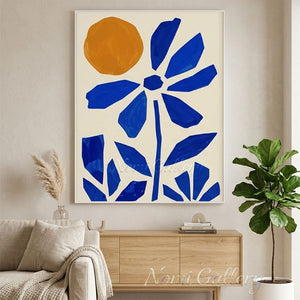 100% hand-painted mid-century minimalist abstract oil painting featuring a geometric cobalt blue flower and a warm orange sun on a neutral cream canvas, styled as an oversized statement art piece above a wooden coffee table in a modern minimal living room as seen in Large-Blue-Abstract-for-room-decor.jpg and Large-Blue-Abstract-for-modern-living-room.jpg.