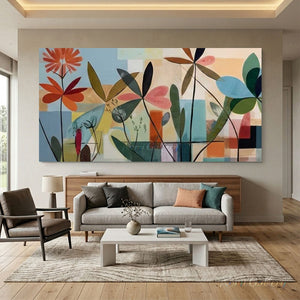 100% handmade abstract botanical oil painting featuring geometric floral and leaf motifs in vibrant orange and blue tones, displayed in a modern interior setting.