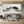 100% handmade bull and bear oil painting featuring a dynamic financial animal clash in neutral tones with gold accents, displayed in a modern executive office setting.