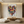 Large hand-painted abstract oil painting of a vibrant multi-colored heart with thick 3D textures, displayed in a modern zen-style living room with a low wooden table and floor cushions.