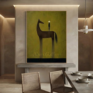 100% handmade minimalism equestrian oil painting in olive and earth tones featuring a horse and rider, displayed above a wooden credenza in a boho living room by Nomi Gallery.