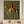 100% handmade surrealism equestrian oil painting in olive green tones featuring a stylized rider on a spotted horse, displayed above a wooden bench in a modern corridor by Savy Canvas.