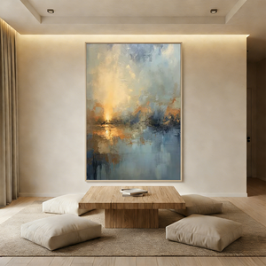 Hand-painted Wabi-Sabi abstract oil painting featuring a golden sunrise over misty blue mountains, styled in a minimalist boho living room above a beige sofa.