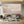 100% handmade impressionist birds in flight oil painting featuring a flock soaring through a soft pink and neutral sky, displayed in a modern living room setting.