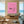 High-end handmade minimalist oil painting with a thick, textured vibrant pink impasto background, depicting a male diver swimming horizontally and a female diver plunging vertically.