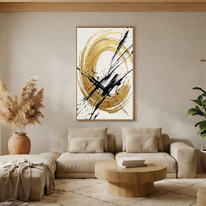 Handmade modern abstract canvas painting showcasing a large textured metallic gold circle dramatically intersected by bold black calligraphic brushstrokes and splatters on a white background.