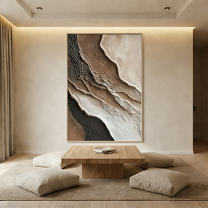 Close-up of a hand-painted heavy texture abstract oil painting with 3D layered ridges in mocha and cream tones, enhancing a minimalist interior.