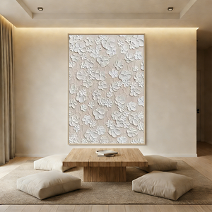 Hand-painted 3D white floral texture wall art with thick sculpted petals on a beige background, displayed in a cozy Boho living room above a cream sofa.