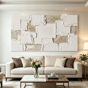 A detailed view of a 100% hand-painted minimalist oil painting featuring thick 3D textured off-white impasto blocks on a beige sandy background with a fine grid engraved in the center.
