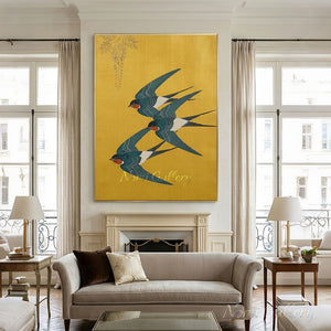 A hand-painted Japanese-style artwork featuring three teal-blue and rust-red swallows flying dynamically against a textured golden yellow background, with a delicate hanging wisteria branch in the top-left corner.