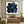 A 100% hand-painted modern abstract oil painting featuring bold, dynamic swirling brushstrokes of deep navy blue and black in the center against a stark white background.