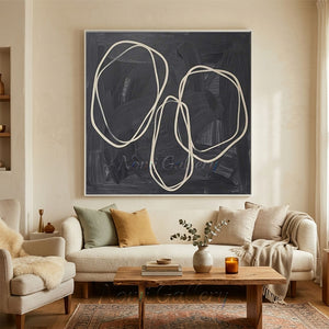 A 100% hand-painted modern minimalist oil painting featuring continuous organic oval lines in cream color over a heavily textured charcoal black and dark grey background.
