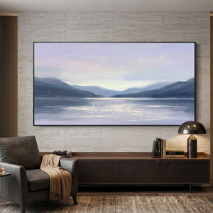 Hand-painted minimalist textured oil painting showing a calm lake reflecting a golden sun with misty layered mountains in muted teal and slate grey in the background.