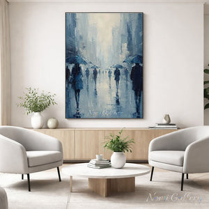 A 100% handmade abstract Impressionist oil painting of a rainy city street, showing figures with blue umbrellas walking down a misty avenue with rich palette knife textures and reflections.