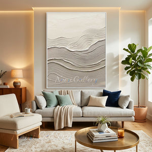 Large original handmade 3D heavy textured minimalist oil painting showcasing grand vertical wave patterns in oatmeal beige and soft cream, hanging on a neutral plaster wall behind a luxury modern sofa in an upscale Wabi-Sabi living room.