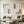 A 100% hand-painted modern minimalist oil painting featuring thick, cross-hatch textured plaster white geometric blocks over a warm sandy-grey beige background.