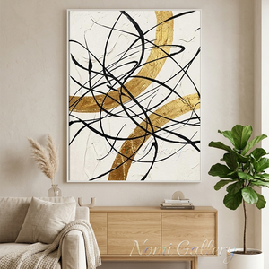 Large original handmade modern abstract oil painting featuring fluid wavy lines in charcoal black and metallic gold leaf, beautifully displayed on a white wall next to a modern staircase with dark wood steps.