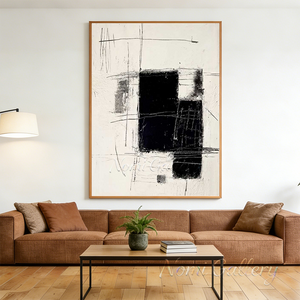 Large original handmade minimalist black and white abstract oil painting featuring sweeping charcoal lines on a pure white canvas, displayed on a gallery wall next to a modern black iron frame staircase.