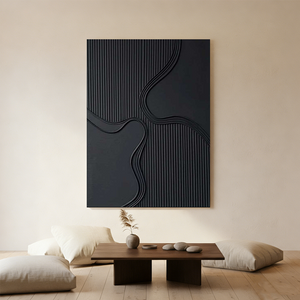 Close-up of a large hand-painted 3D textured black abstract oil painting with heavy cracked earth patterns, styled in a contemporary minimalist living room.