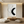 Close-up of a hand-painted 3D textured oil painting featuring a bold black swoosh and white impasto strokes on a minimalist canvas, styled in a modern Wabi-Sabi living room.